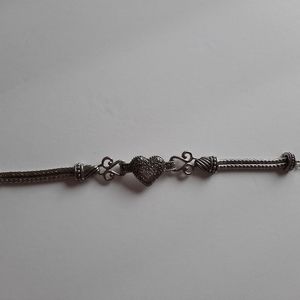 Silver Plated Bracelet with heart in center.
